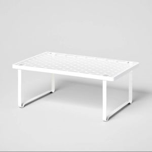 Punched metal shelf for additional storage